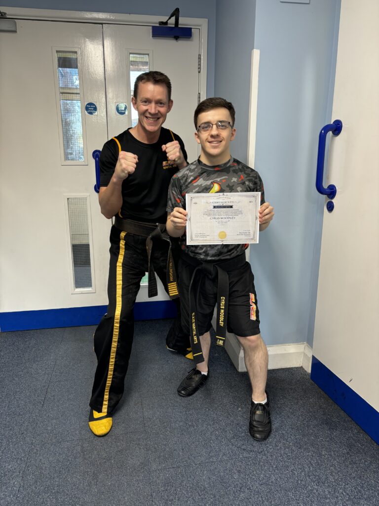 Cyrus receiving his 1st dan black belt at Blaze Martial Arts with chief instructor Justyn Billingham