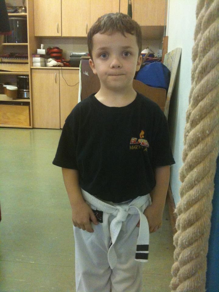 Kickboxing coach, Cyrus wearin ghis white belt in the children's martial arts class at Blaze Martial Arts, Ascot