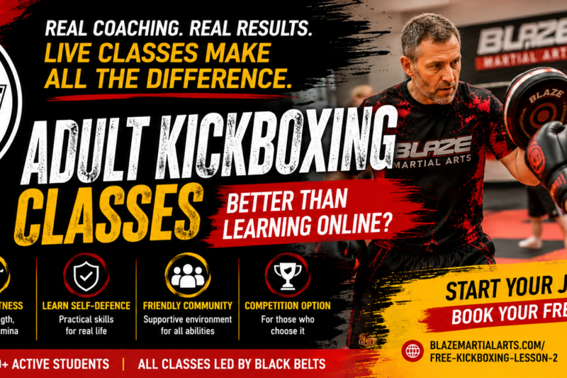 Adult kickboxing classes at Blaze Martial Arts with an instructor coaching a student during pad training.