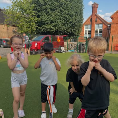 Child developing self-esteem and discipline through kickboxing classes in Bracknell